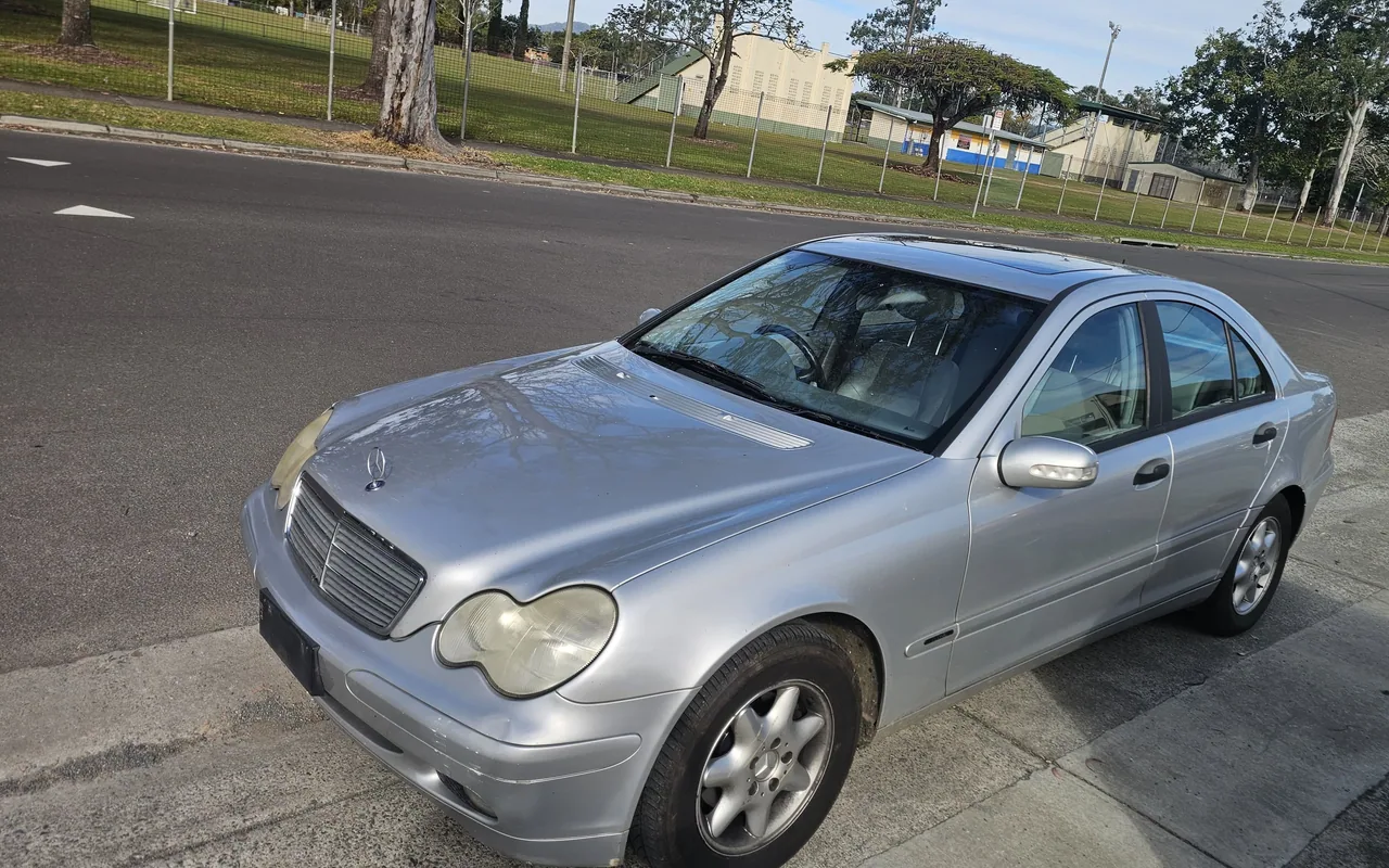 Silver Mercedes-Benz C-Class previously purchased by AK Cash for Cars