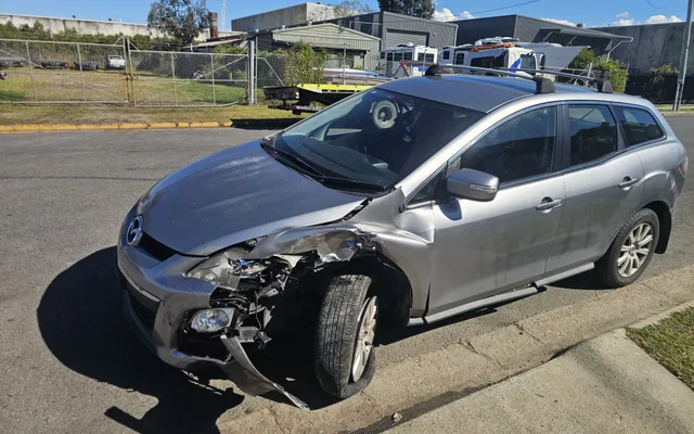 Damaged Mazda CX-7 from the AK Cash for Cars purchase collection