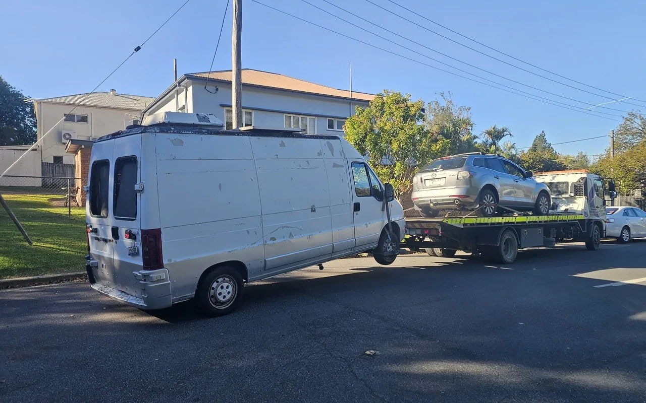 SUV secured to a tow truck during a vehicle collection
